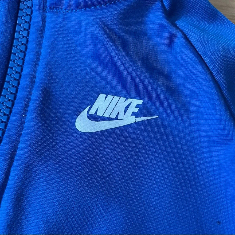 Nike both tracksuits